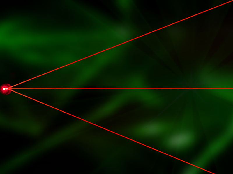 rote Laserstrahlen auf einen Punkt zentriert